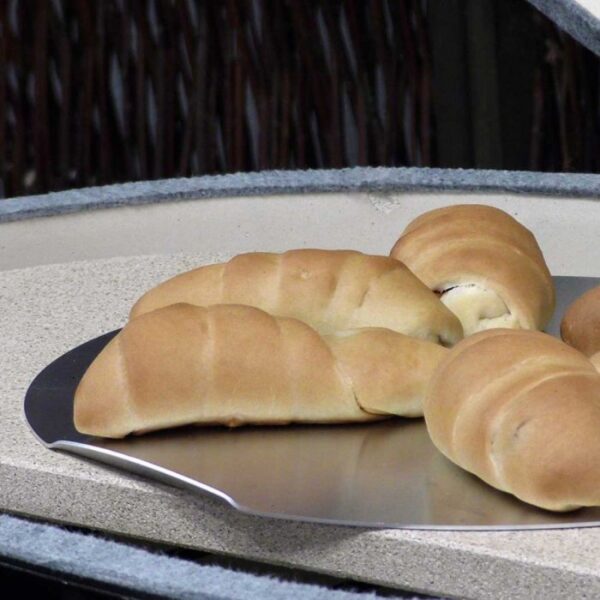 Freshly baked bread rolls on a metal tray, showcasing a golden-brown crust and soft texture.