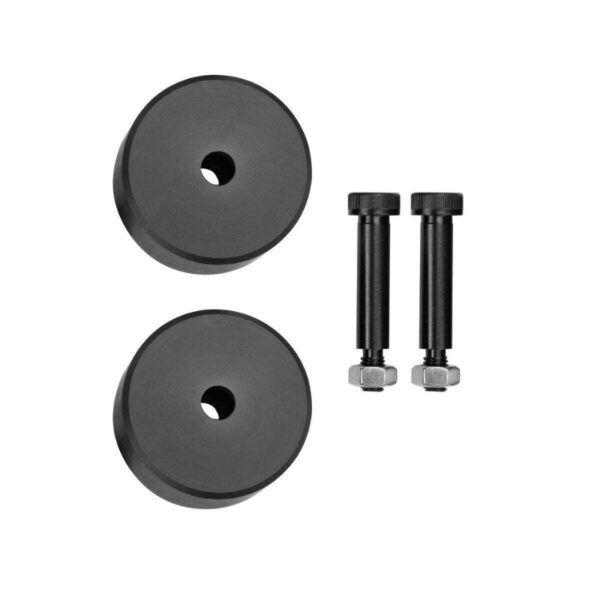 Black rubber spacers with bolts for automotive suspension adjustment, designed to enhance vehicle performance and stability.