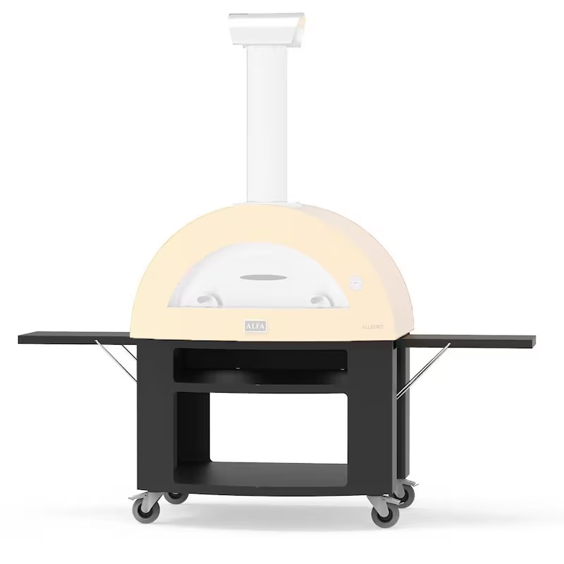 Wood-fired pizza oven with a pale yellow dome and black cart, featuring a chimney and spacious side shelves, suitable for outdoor cooking.