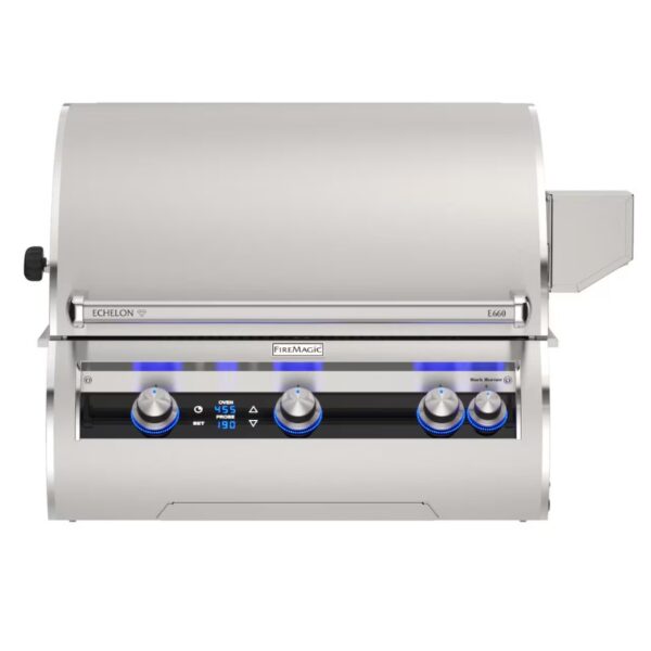 Stainless steel Fire Magic E660 grill with digital controls and illuminated knobs, designed for outdoor cooking.