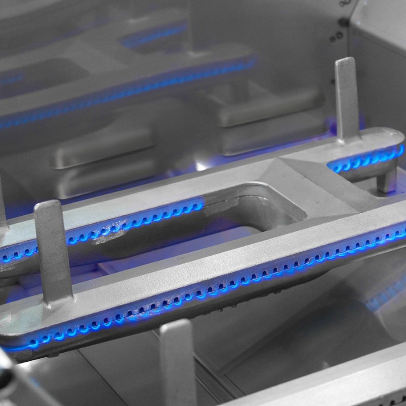 Close-up of a modern gas burner with blue flame igniters, showcasing a sleek metallic design ideal for efficient cooking.