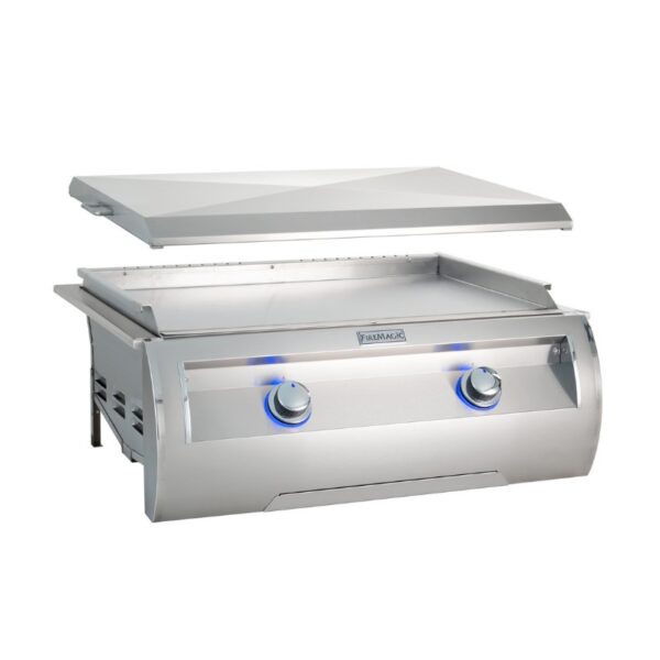 Stainless steel outdoor grill with an open lid and illuminated control knobs, designed for high-performance cooking.