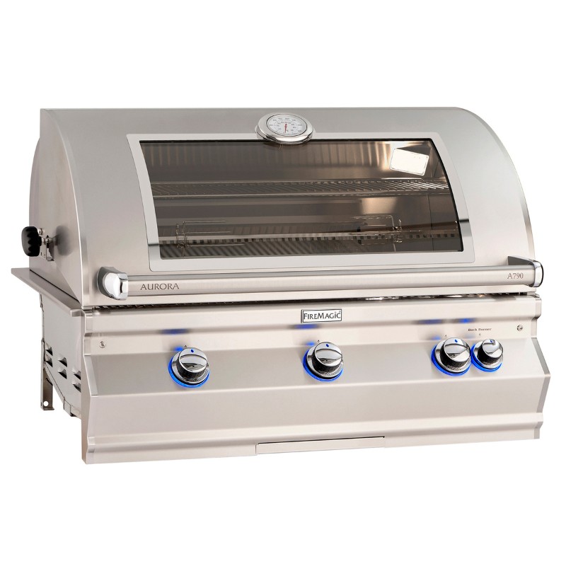Stainless steel Fire Magic Aurora A790 gas grill with a glass viewing window and three control knobs, featuring a built-in thermometer for precise temperature monitoring.
