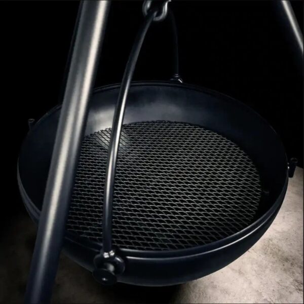 Cast iron cooking tripod with a mesh grill, ideal for outdoor grilling and campfire cooking.