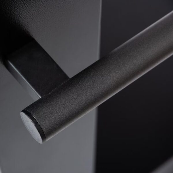 Close-up of a black metallic door handle against a dark background, showcasing its smooth finish and modern design.