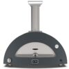 Portable outdoor pizza oven with a sleek gray design, chimney, and temperature gauge, ideal for baking authentic pizzas in a backyard setting.
