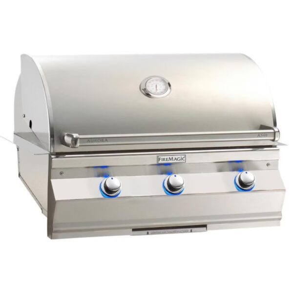 Stainless steel Fire Magic Aurora A540 gas grill featuring three control knobs and a temperature gauge on the hood.