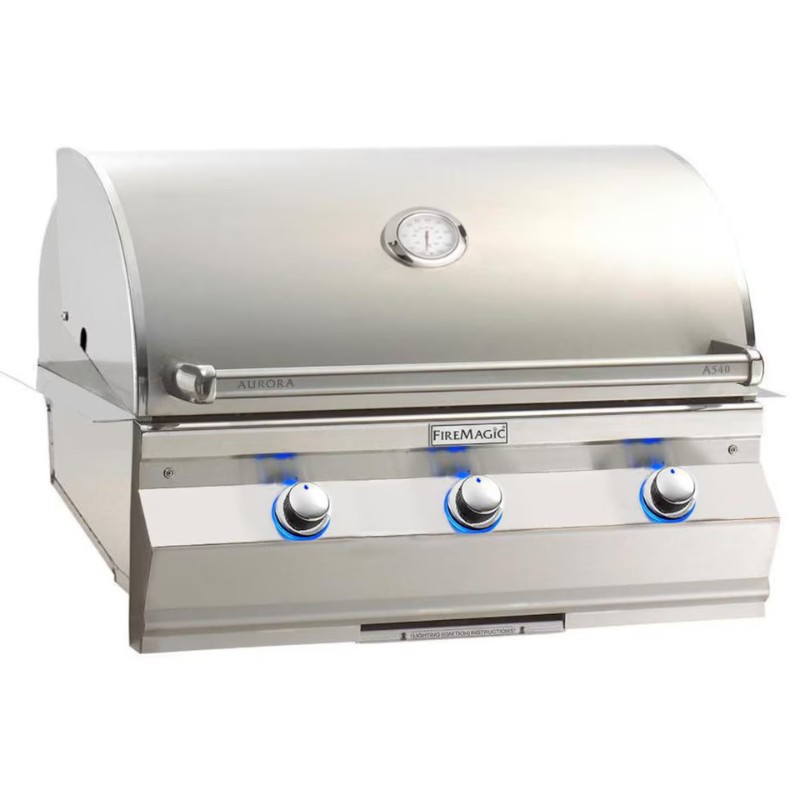 Stainless steel FireMagic Aurora A540 gas grill featuring a hood, temperature gauge, and three illuminated control knobs for efficient grilling.