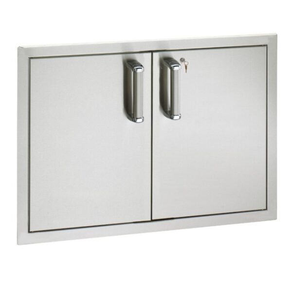 Stainless steel outdoor cabinet with double doors and sleek handles, ideal for storing grilling tools and accessories.