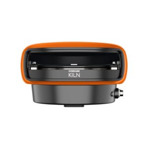 Compact Everdure Kiln, a versatile outdoor cooking appliance with an orange trim, designed for grilling and smoking. Features a sleek front design with adjustable heat settings.