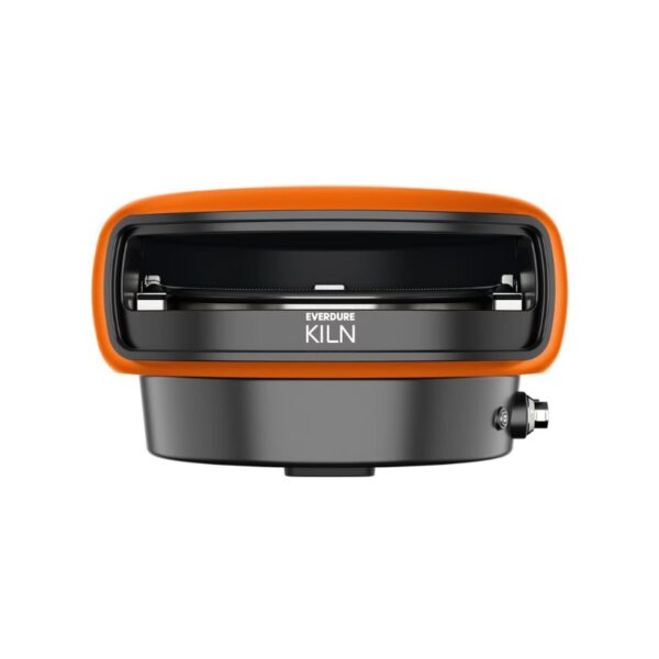 Compact Everdure Kiln, a versatile outdoor cooking appliance with an orange trim, designed for grilling and smoking. Features a sleek front design with adjustable heat settings.