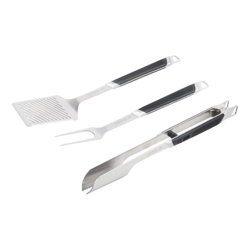 Set of stainless steel grilling tools including a spatula, fork, and tongs with rubberized handles for superior grip and control.