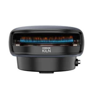 Everdure Kiln portable gas grill with blue flame, featuring a sleek design and compact base for outdoor cooking.