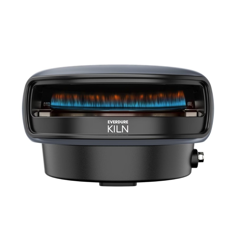 xr:d:DAF55QRPwos:4,j:7166768407878280865,t:24011421 Everdure Kiln portable gas grill with blue flame, featuring a sleek design and compact base for outdoor cooking.