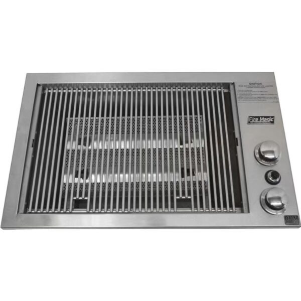 Stainless steel Fire Magic grill with adjustable knobs and slatted cooking surface, ideal for outdoor cooking.