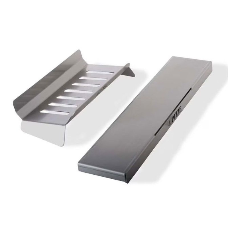 Stainless steel pizza oven accessories, including a pizza guide and a sliding tray, designed for efficient pizza preparation and cooking.