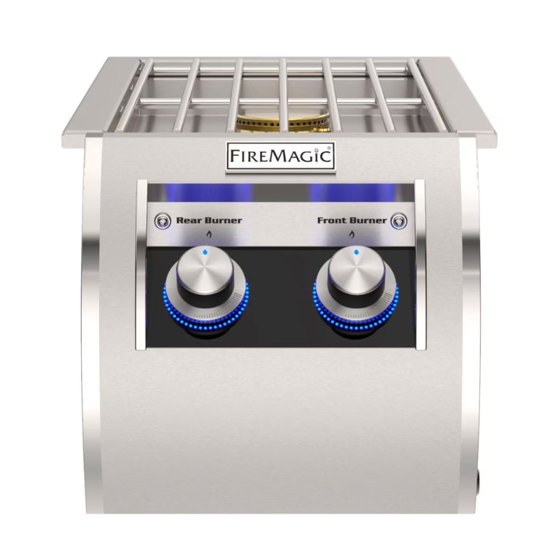 Stainless steel Fire Magic grill top featuring two control knobs for front and rear burners, illuminated with blue LED indicators.