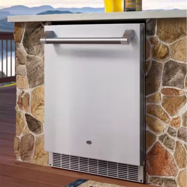 Outdoor stainless steel refrigerator built into a stone wall, ideal for patio or deck use.