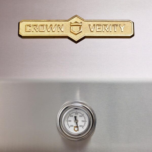 Crown Verity grill logo with a stainless steel surface and temperature gauge displaying Fahrenheit readings.