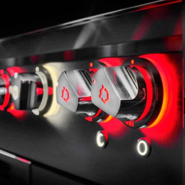 Close-up view of modern appliance knobs with illuminated indicators, featuring sleek stainless steel design and vibrant red lighting, showcasing cooking controls.