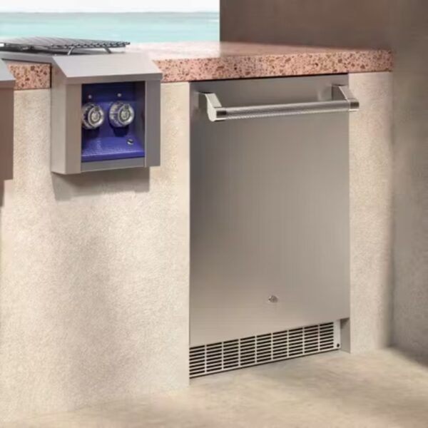 Stainless steel outdoor refrigerator built into a countertop, featuring a sleek design and easy-to-use handle, alongside a blue control panel with two dials.