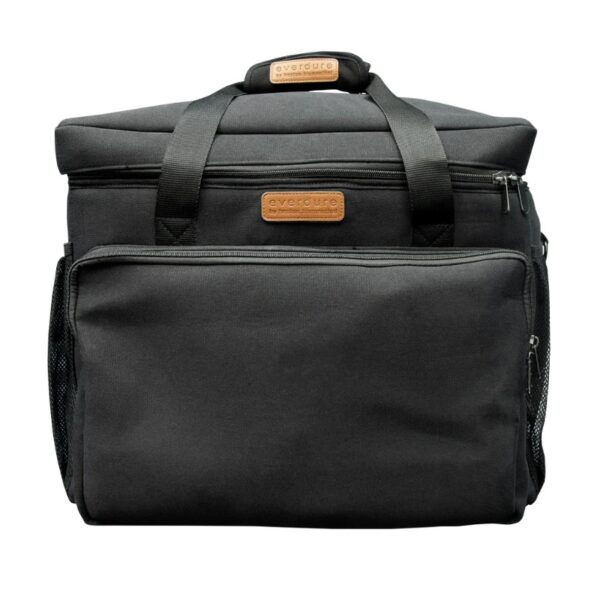 Black insulated cooler bag with a zippered front pocket and sturdy handles, featuring a leather label.