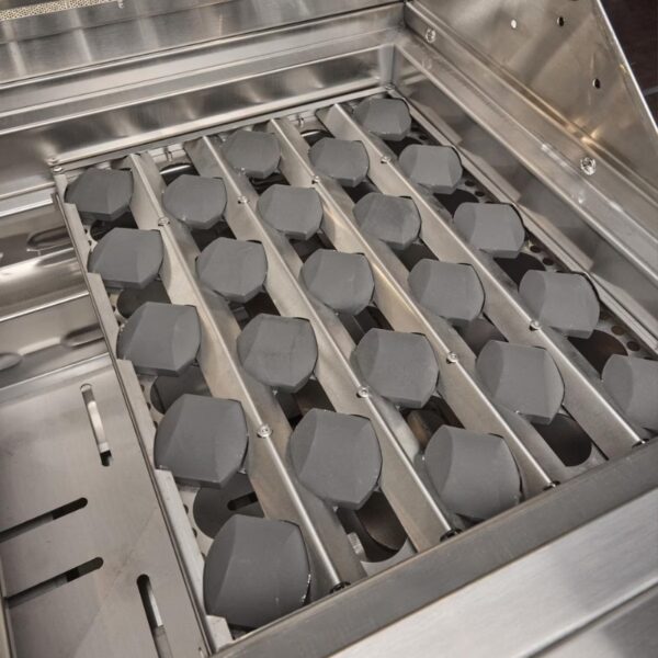 Close-up of a stainless steel grill with hexagonal charcoal briquettes arranged in rows, designed for efficient heat distribution and grilling performance.