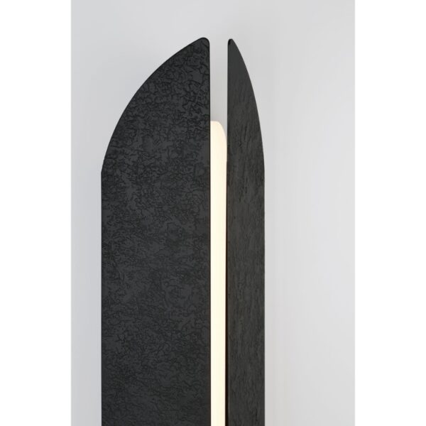 Modern black floor lamp with a textured surface and an illuminated central strip, designed for contemporary interiors.