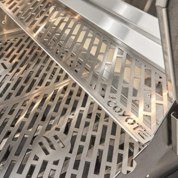 Close-up of a stainless steel grill grate with a Coyote logo, featuring a modern design and slotted pattern for optimal heat distribution.