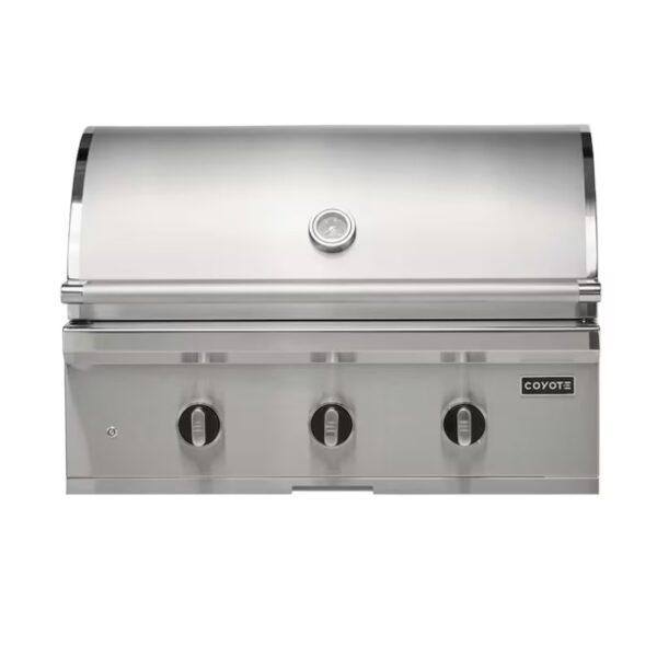 Stainless steel Coyote outdoor gas grill with three control knobs and a lid, designed for efficient grilling.