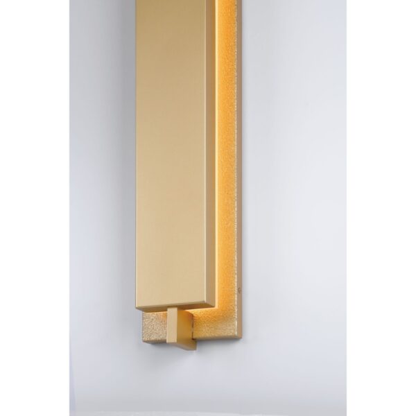 Sleek gold wall-mounted light fixture with an illuminated edge, designed for modern interior decor.