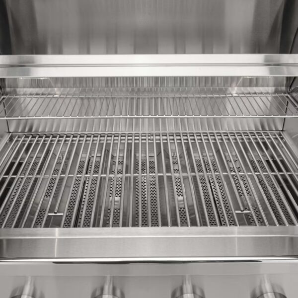 Stainless steel grill interior with multiple cooking grates and burners, designed for outdoor cooking.