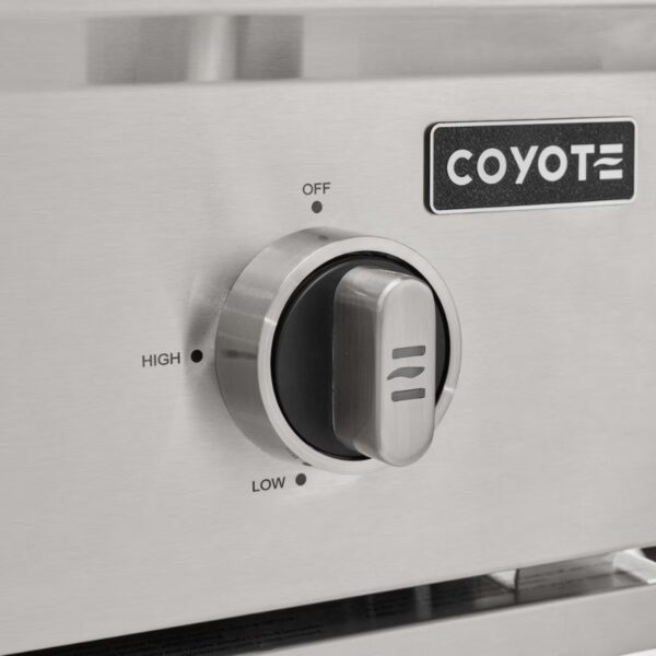 Close-up of a stainless steel control knob for a Coyote grill, featuring settings for off, low, and high heat.