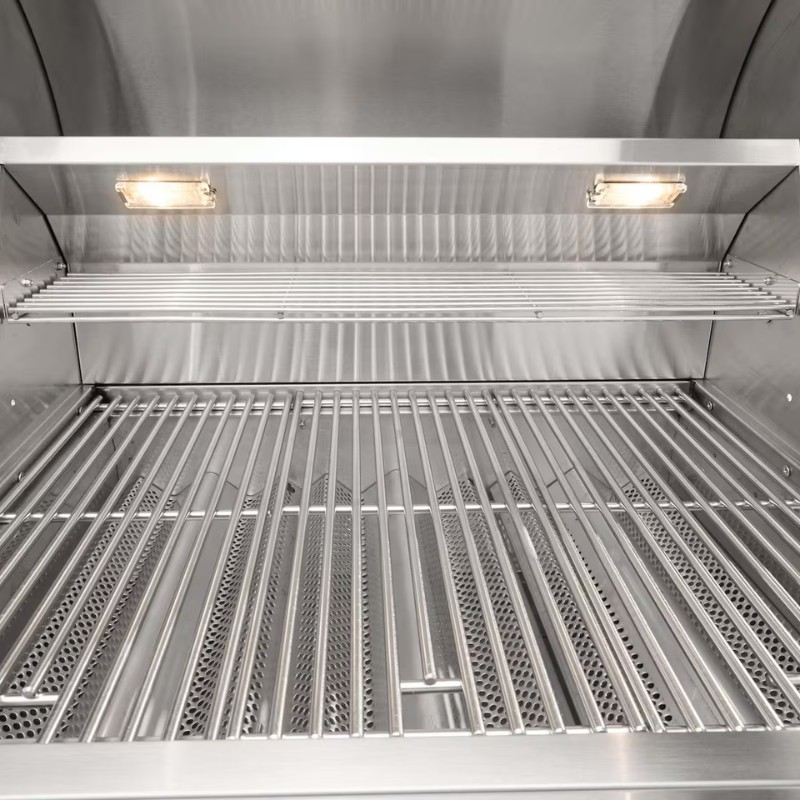 Stainless steel outdoor grill interior with two adjustable shelves and built-in lights.