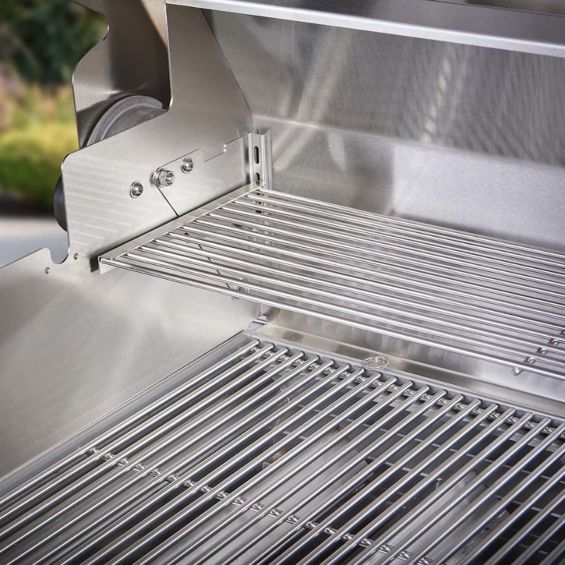 Close-up of a stainless steel grill interior featuring two levels of evenly spaced grilling grates, designed for efficient cooking and heat distribution.