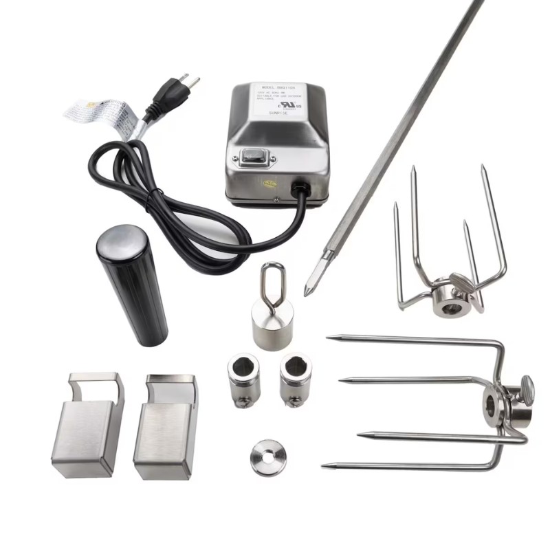Electric grill rotisserie kit featuring a motor, skewers, forks, and clamps for outdoor cooking.