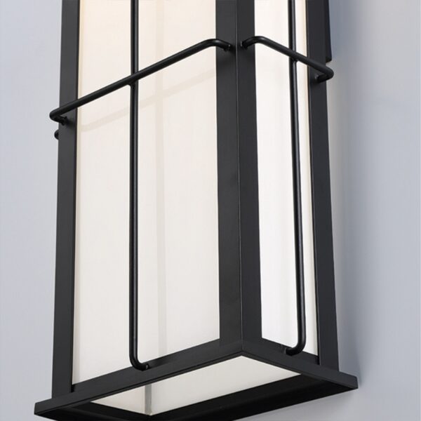 Modern black and white wall light fixture with a sleek geometric design and frosted glass panels, perfect for contemporary interior decor.