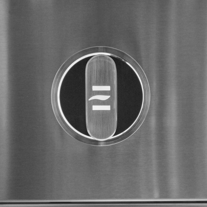 Close-up of a stainless steel appliance control panel featuring a circular button with a sleek design, displaying symbols for power and temperature control.