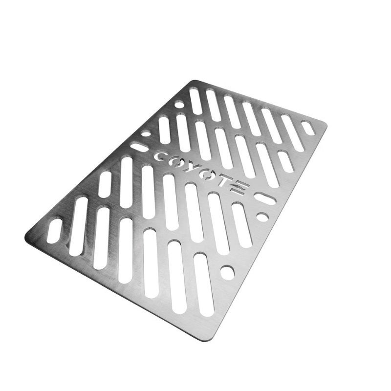Stainless steel grill plate with slotted design, featuring the Coyote logo, ideal for enhancing outdoor cooking.