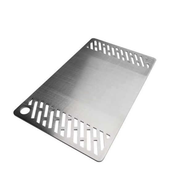 Stainless steel cutting board with drainage holes for easy cleanup and food prep.
