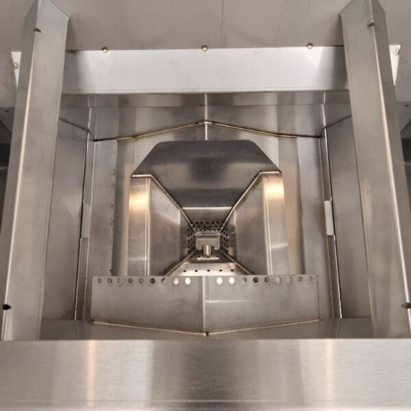 Interior view of a stainless steel kitchen appliance featuring a geometric design with a central perforated area and angled edges for efficient airflow.