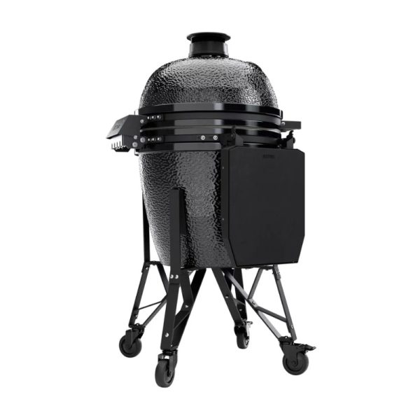 Black ceramic kamado grill on a sturdy wheeled stand, designed for outdoor cooking and smoking.