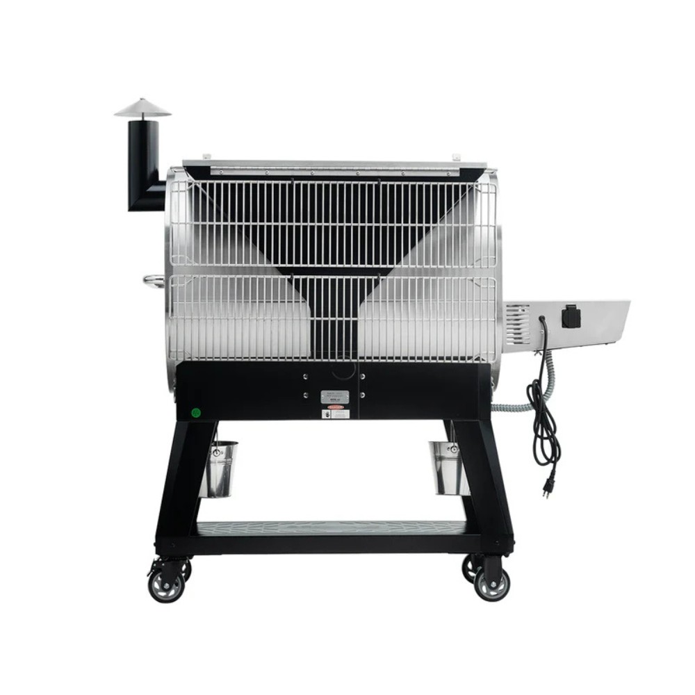 Portable outdoor smoker with a stainless steel finish, featuring a chimney, wheels for mobility, and two side buckets for wood chips. Ideal for barbecuing and smoking meats.
