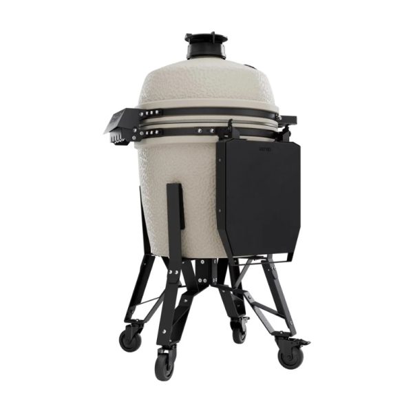Ceramic grill with a textured beige exterior mounted on a black wheeled stand, featuring a side shelf for storage. Ideal for outdoor cooking and grilling.