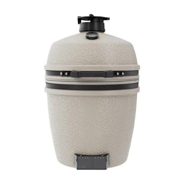 Large beige outdoor ceramic grill with a textured surface, temperature gauge, and adjustable air vent for precise cooking control.