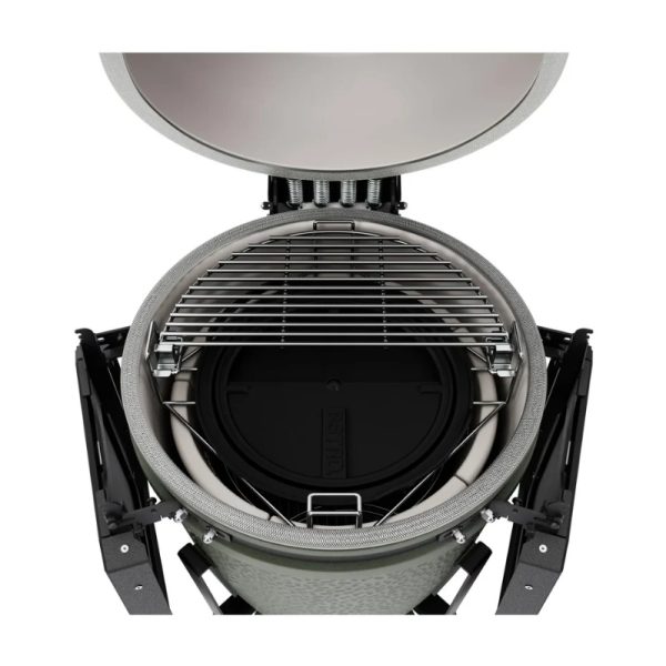 Top view of a ceramic grill with a stainless steel cooking grate and a closed lid, showcasing its interior design and features.