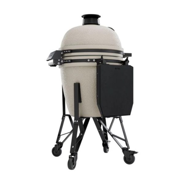 Ceramic charcoal grill on a mobile cart, featuring a textured cream exterior and a black side shelf for storage.