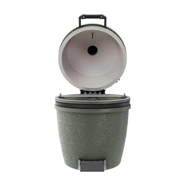Green outdoor cooking grill with a hinged lid and textured exterior, designed for barbecue and smoking.
