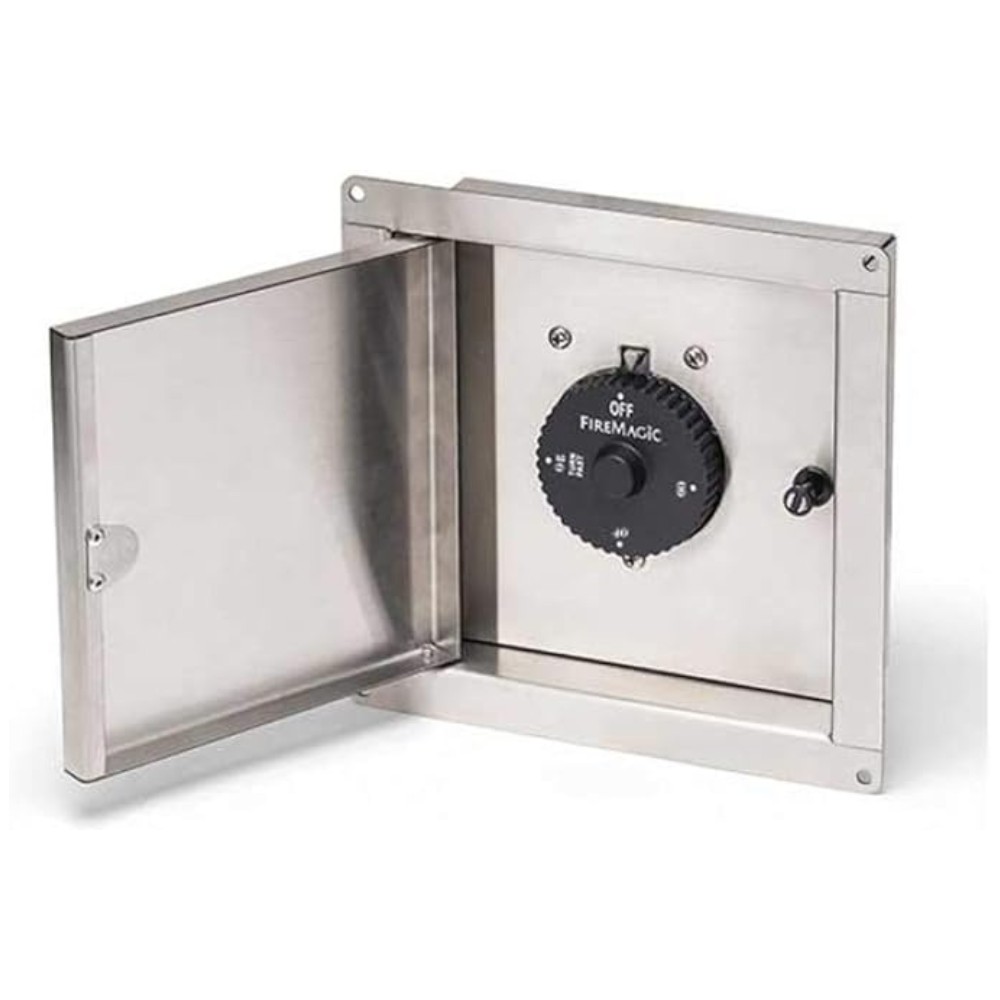 Stainless steel access panel with a black control dial for a FireMagic appliance, featuring an open door and adjustable settings.
