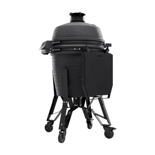Black ceramic grill on a mobile cart with wheels, featuring a textured surface and an attached side shelf for convenience.